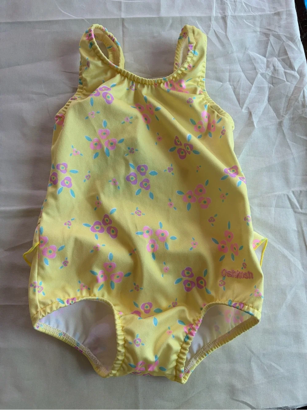 VINTAGE OshKosh B'gosh Yellow Baby Garment with Blue Logo and Pink Floral Accent